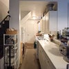Photo 9: Fully-stocked kitchen on first floor has a gas stove, oven, microwave, fridge/freezer, and other sma