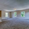 Photo 7: Large living area. Has couch, table, chairs, TV, etc