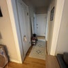 Photo 5: Coat closet and front door 