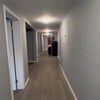 Photo 2: Available bedroom is the first door on the left. The living room is past that on the left.
