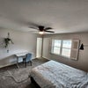 Photo 2: Private Master bedroom. Has desk, bed, nightstand. Attached closet and private bath