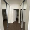 Photo 2: Dual closet space + full length mirrors