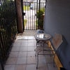 Photo 3: Front enclosure patio near rental rm