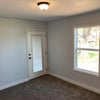 Photo 2: Bedroom with private door to backyard