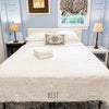 Photo 1: The room's Queen-sized bed features a built-in 3" cooling gel topper and is raised to provide conven