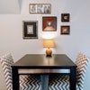 Photo 4: The bar-height table in the home's kitchenette is an excellent place for enjoying meals or simply un