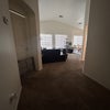 Photo 4: Primary bedroom door and living room