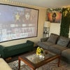 Photo 5: Chill living room — projector setup for movie nights.