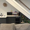 Photo 8: Living Room Furnished with Bar, Couch, cabinets and Mounted TVC