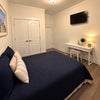 Photo 2: Room with bed and desk  