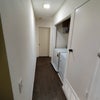 Photo 3: Washer and dryer on premise in hallway
