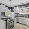 Photo 2: shared kitchen, bathroom to the left