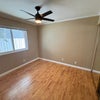 Photo 2: Comfortable private room with hardwood floors and plenty of flexibility for your ideal setup