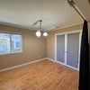 Photo 3: Multiple windows and an open layout create a comfortable, airy living space.