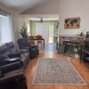 Photo 5: Comfortable shared living area with plenty of space to relax and unwind.