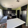 Photo 6: Full kitchen access with generous counter space, full-size appliances, and plenty of storage.