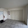 Photo 6: Second Bedroom (Wall items have been removed)