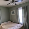 Photo 5: bed and dresser new curtains paint and ceiling fan