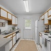 Photo 3: Official model kitchen; finishes may vary.
