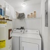 Photo 7: Official model laundry area; finishes may vary.