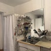 Photo 7: Kitchen sink next to shower stall 