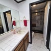 Photo 6: Master Bathroom Sink with door open to Budet and Shower