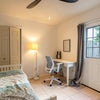 Photo 3: Ceiling fan, writing desk, dresser, 32 in Smart TV