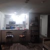 Photo 3: View of the kitchen with chairs 