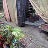 Photo 6: Lovely back patio with Gazebo that has screens and shade curtains