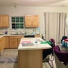 Photo 6: Kitchen island and dining room 