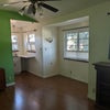 Photo 4: Living room with kitchenette space. 
