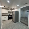 Photo 2: Kitchen with Stove and Fridge included 