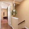Photo 5: Top of Stairs - Looking toward taken room