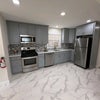 Photo 3: Fully stocked kitchen