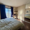 Photo 3: great natural light (with blackout curtains) that goes out to a balcony. 