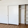 Photo 3:     11-foot-wide closet with shelving and overhead storage