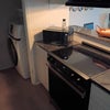 Photo 8: Kitchen and laundry room with washer and dryer