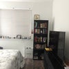 Photo 3: TV and bookshelf