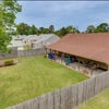 Photo 2: Backyard with covered patio