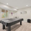 Photo 5: Pool table in basement