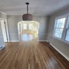 Photo 2: View from the perspective of the dining area, doorway goes into the living room. 