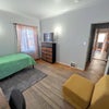 Photo 3: 1st floor SRO | Bed, tv, dresser and couch