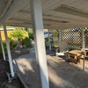 Photo 8: Covered front porch sitting area
