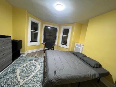 Nice large semi-furnished room for weekly rent. Main Photo