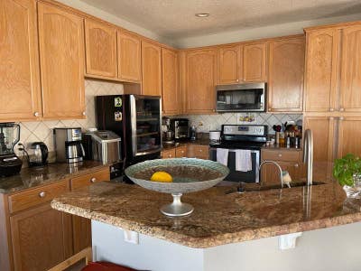 Bedroom with queen bed and adjacent bathroom  Main Photo