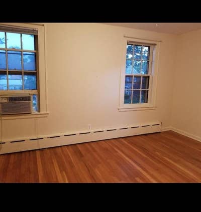 Room 3 windows tree lined street wood floors safe Main Photo