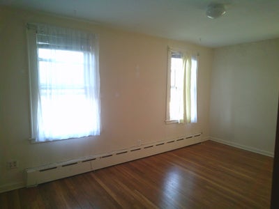 Room 3 windows tree lined street wood floors safe Main Photo