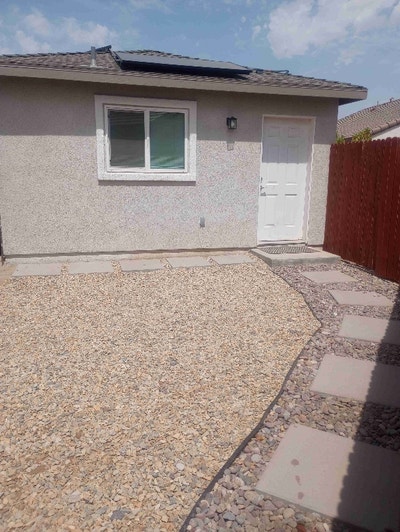 Outdoor space. Fully landscaped front yard with ba Main Photo