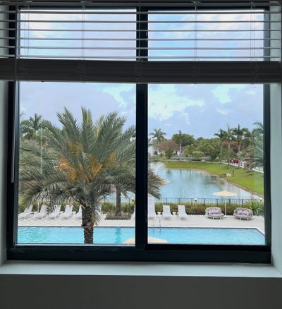 “Master Bedroom w/ Private Bath • Lake & Pool View Main Photo