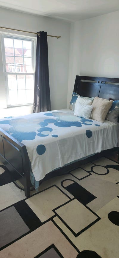 Sunny master bedroom in a beautiful colonial home. Main Photo